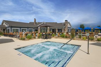 our resort style swimming pool with our building in the background  at Watermark at Harvest Junction, Longmont, Colorado